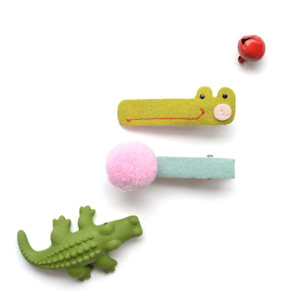 Alligator and pom pom hair clips 1